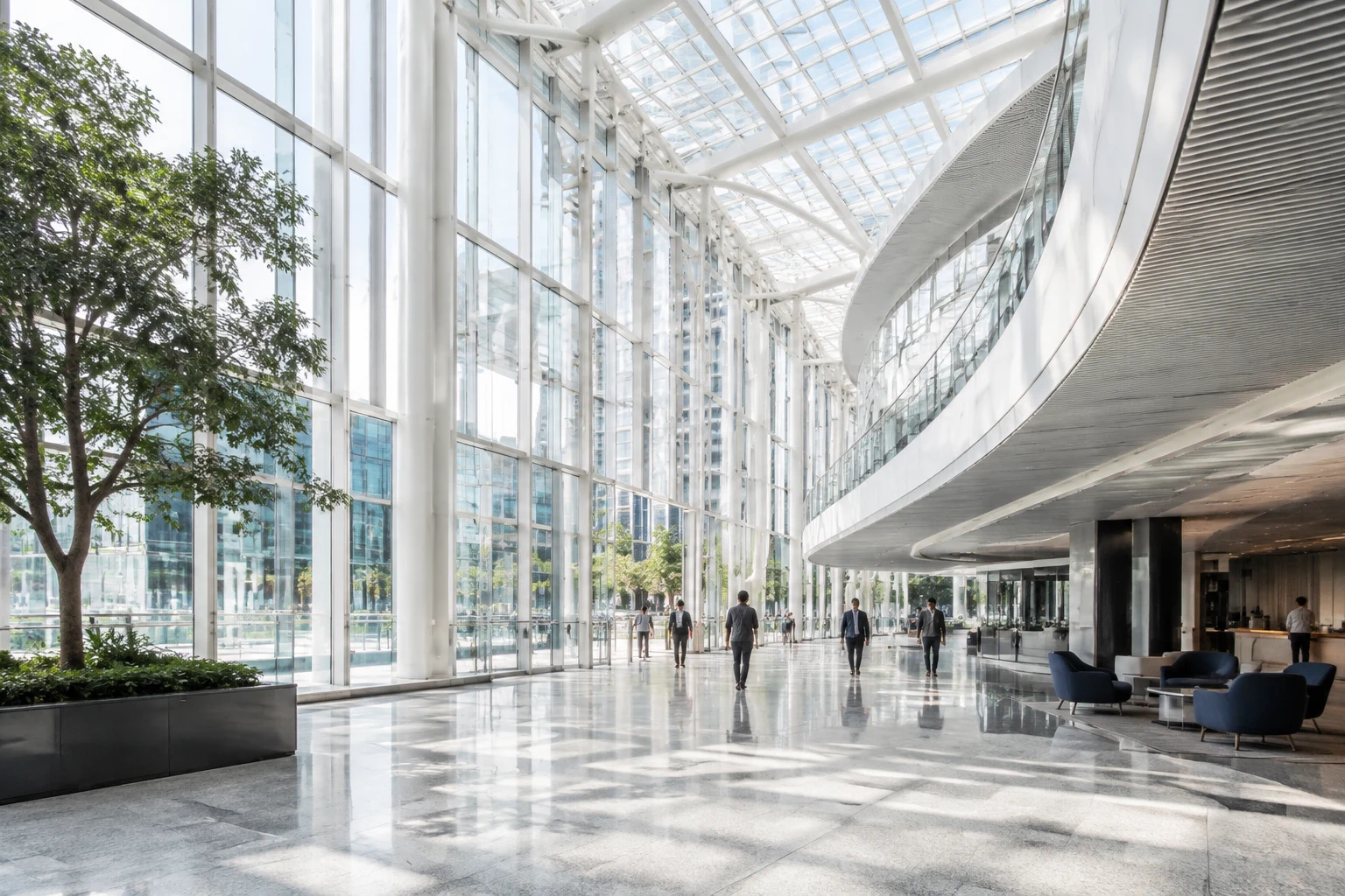 A spacious glass atrium with small figures in the distance